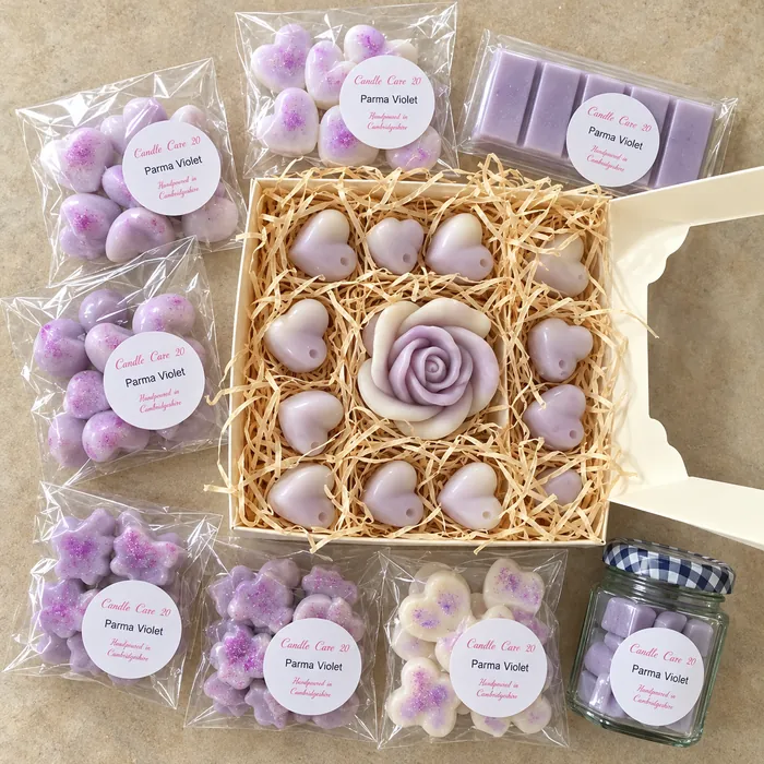 Boxed selection of lilac heart and flower wax melts with a rose melt in the centre